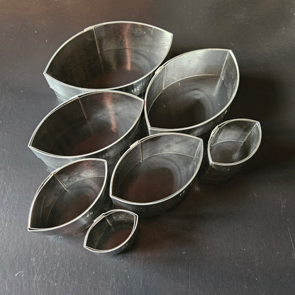 Boîte de 7 découpoirs inox ovales unis